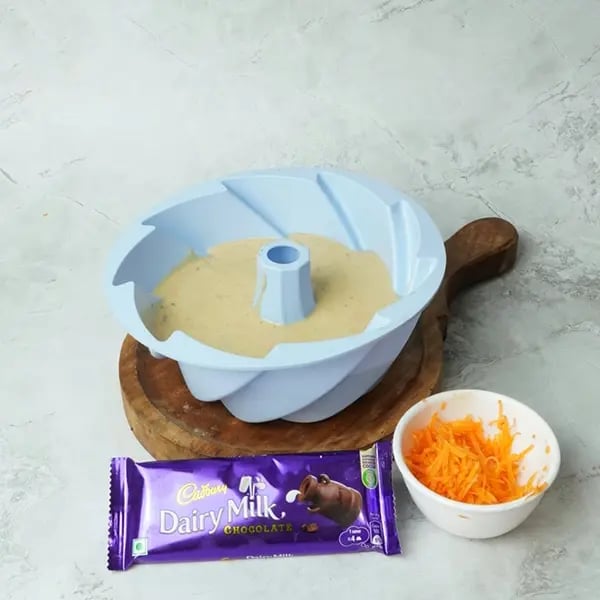 Dairy Milk Carrot Cake-Transfer to a greased baking tray