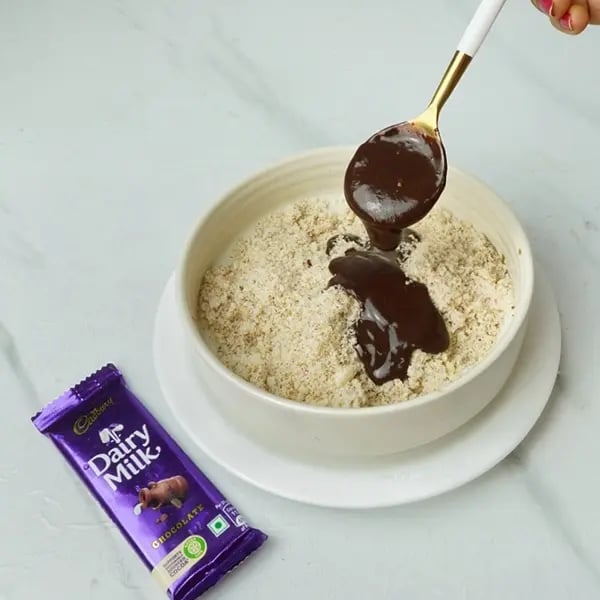 Dairy Milk Chocolate Almond Laddu - Melted chocolate with a coconut-almond
