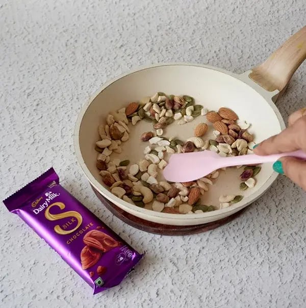 Dairy Milk Chocolate Bark with Mixed Nuts & Fruits - Heat a frying pan