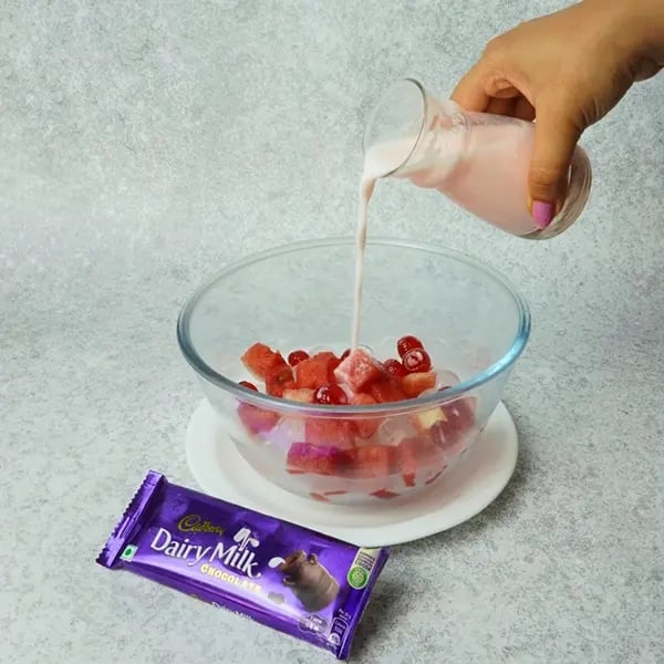 Dairy Milk Chocolate Hwachae Punch-Pour strawberry milk over the fruit