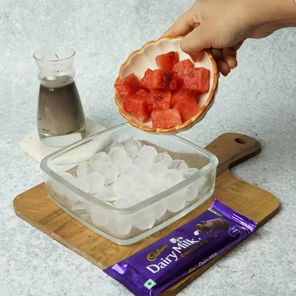 Dairy Milk Chocolate Pearl Mixed Fruit Hwachae-Pour ice cubes into a bowl or tray