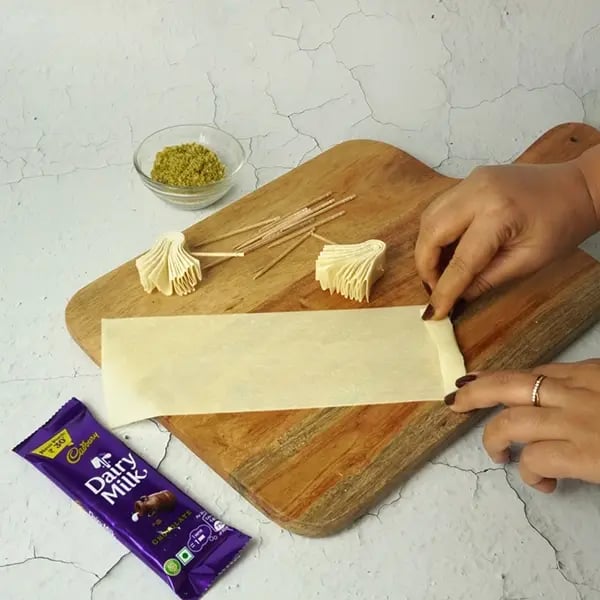 Dairy Milk Coated Baklava Fan Sweet-Fold the samosa sheets like a paper fan