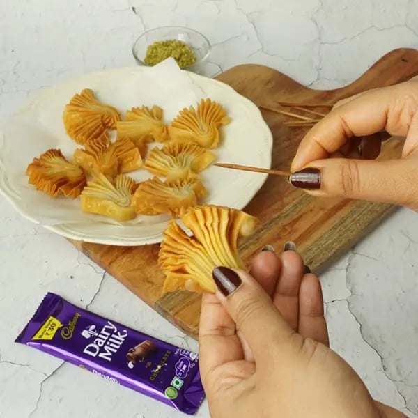 Dairy Milk Coated Baklava Fan Sweet-Once frying is done
