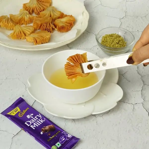 Dairy Milk Coated Baklava Fan Sweet-Dip the cooled fans in the sugar syrup