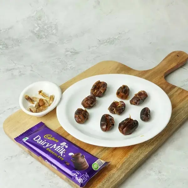 Dairy Milk Coated Peanut Butter Stuffed Dates - Remove the pits from the dates