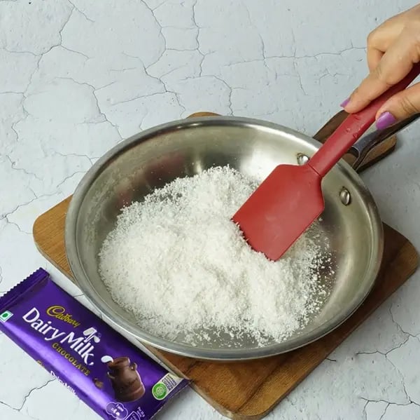Dairy Milk Coconut Karanji-Heat ghee in a small frying pan