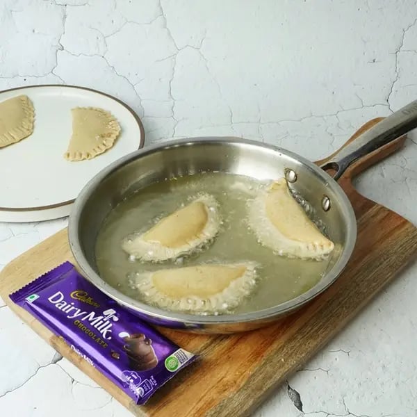 Dairy Milk Coconut Karanji-Heat oil for deep frying