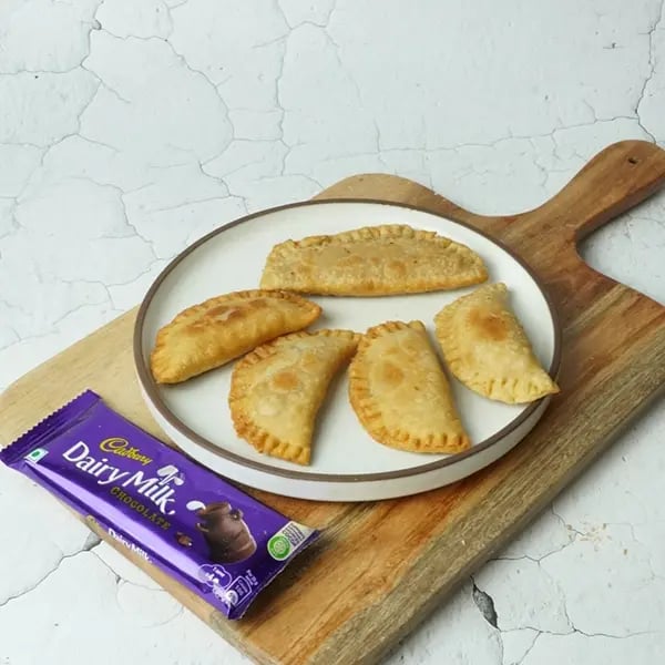 Dairy Milk Coconut Karanji-Fry until golden brown