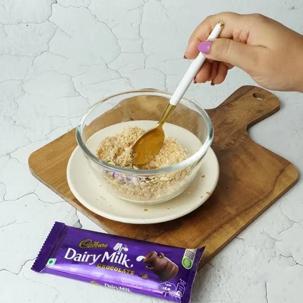 Dairy Milk Coconut Karanji-Add fried sesame seeds