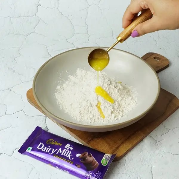 Dairy Milk Coconut Karanji-Take a medium-sized bowl