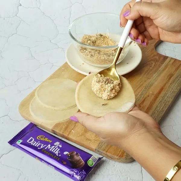 Dairy Milk Coconut Karanji-Place 1 to 2 tablespoons