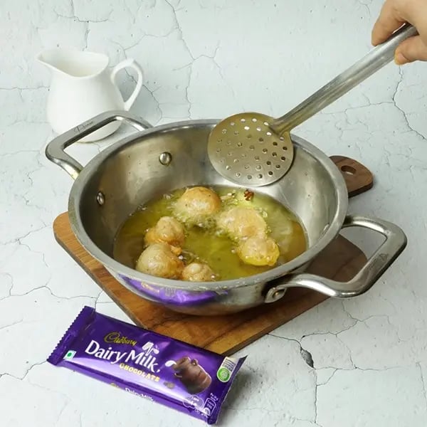 Dairy Milk Covered Cinnamon Loukoumades-Half-fill a large saucepan