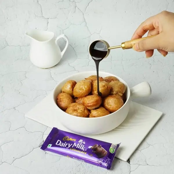 Dairy Milk Covered Cinnamon Loukoumades-Keep all loukoumades in a bowl