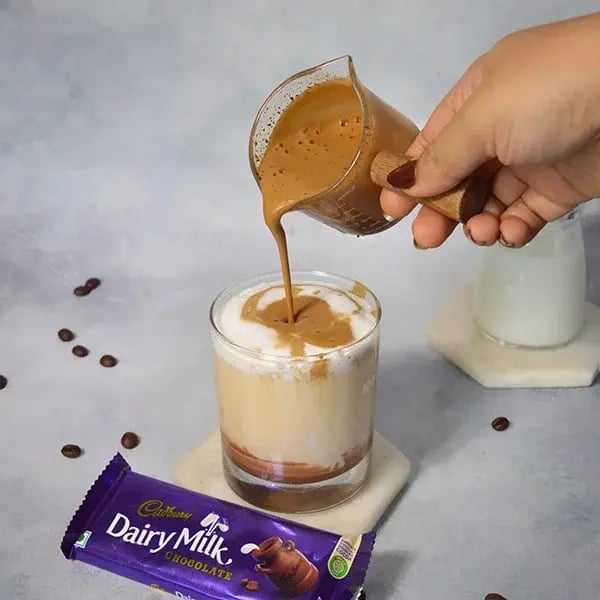 Dairy Milk Dalgona Iced Chocolate Coffee - Sprinkle with coffee powder