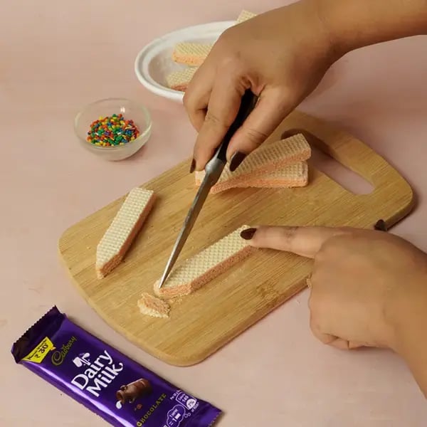 Dairy Milk Dipped Pencil Shape Wafer Cookies For Teacher’s Day - Cut one end of the wafer cookie