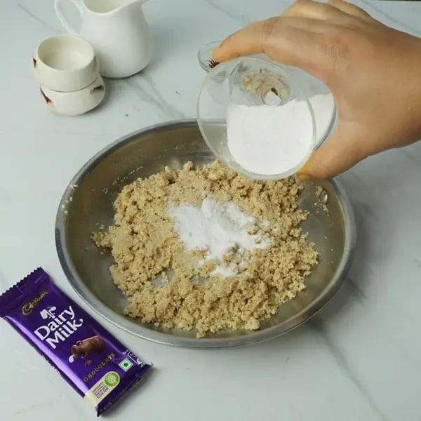 Dairy Milk Drizzle Walnut Kesar Barfi -Now add powdered sugar