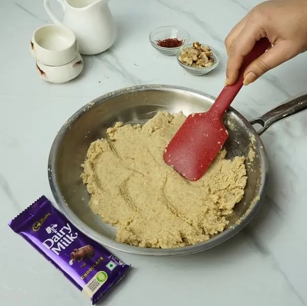 Dairy Milk Drizzle Walnut Kesar Barfi - Stir continuously After 8 to 10 minutes