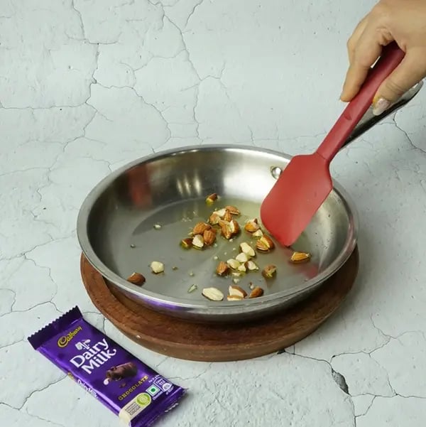 Dairy Milk Dry Fruits Lapsi-Add ghee to a pan