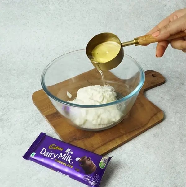 Dairy Milk Eggless Cake with Cocoa-In a medium-sized bowl