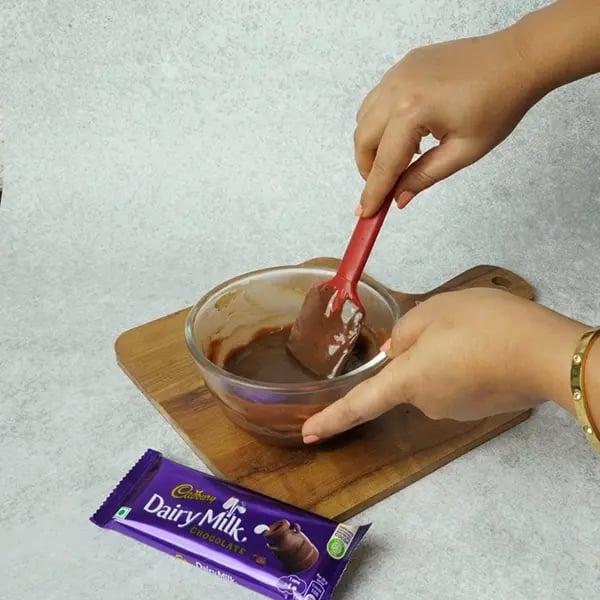 Dairy Milk Eggless Cake with Cocoa-Mix chocolate and cream nicely