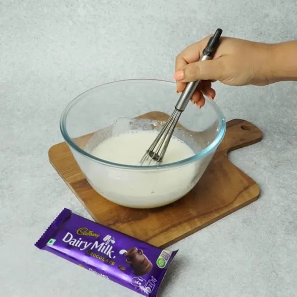 Dairy Milk Eggless Cake with Cocoa-Mix again. Make sure milk is at room temperature