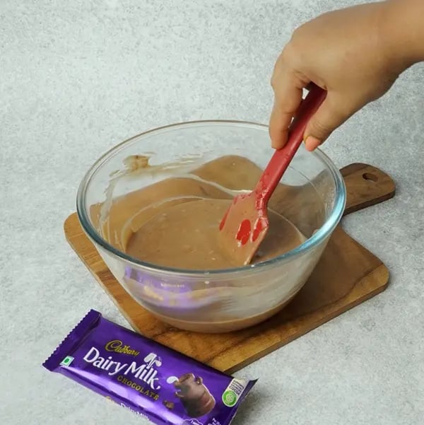 Dairy Milk Eggless Cake with Cocoa-Using a spatula