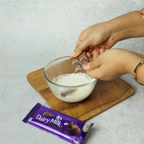 Dairy Milk Eggless Cake with Cocoa-Take a small bowl