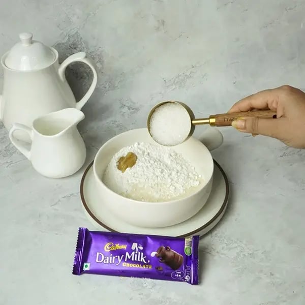 Dairy Milk Glazed Sel Roti- Add semolina rice flour ghee