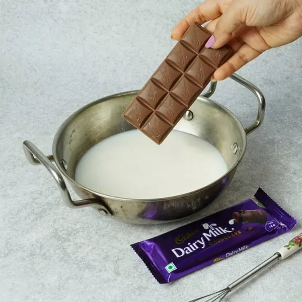 Dairy Milk Gulab Jamun Custard-Heat a pan and bring the remaining milk