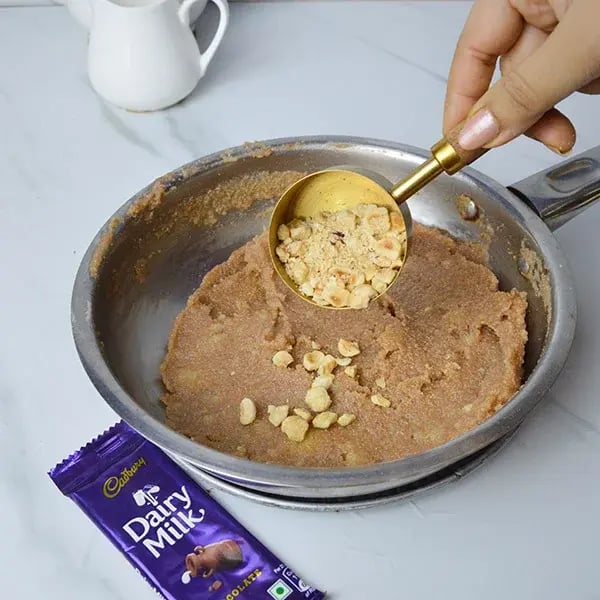 Dairy Milk Hazelnut Suji Halwa - Add chopped hazelnuts