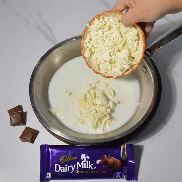 Dairy Milk Infused Thandai Kalakand - Heat milk on low flame