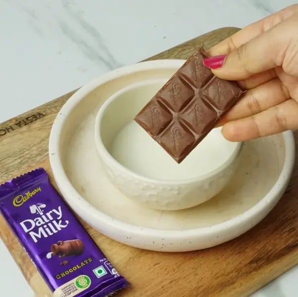 Dairy Milk Malpua with Cashew and Almonds - Warm milk and Cadbury Dairy Milk chocolate