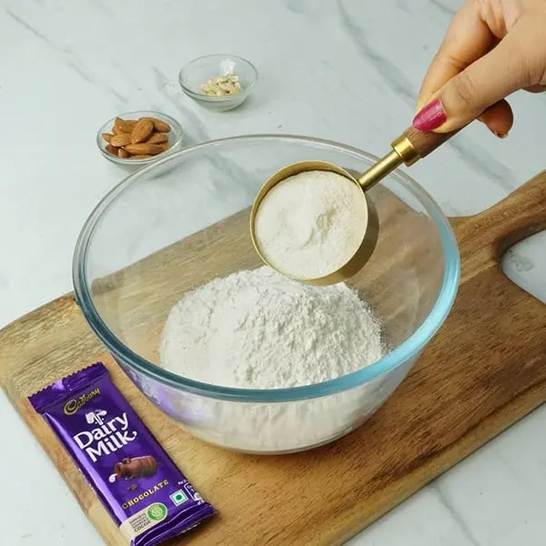 Dairy Milk Malpua with Cashew and Almonds - Flour, semolina, and powdered sugar