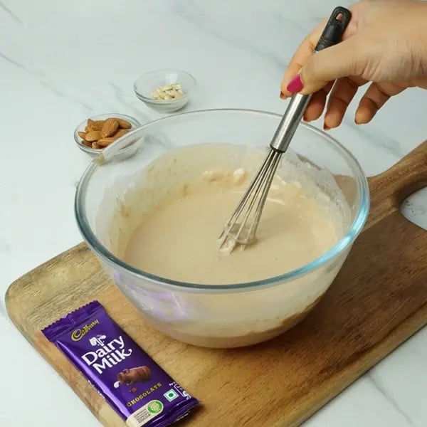 Dairy Milk Malpua with Cashew and Almonds - Mix until you get a smooth batter consistency