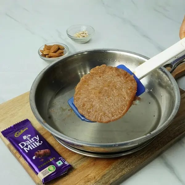 Dairy Milk Malpua with Cashew and Almonds - Fry the malpuas on both sides