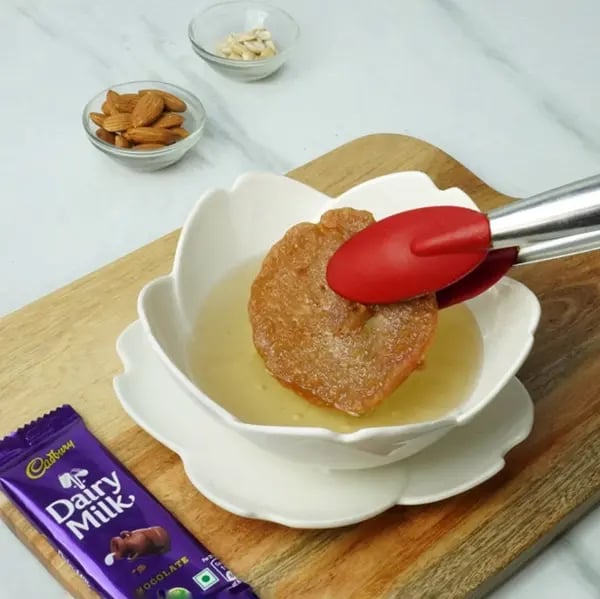 Dairy Milk Malpua with Cashew and Almonds - Hot sugar syrup