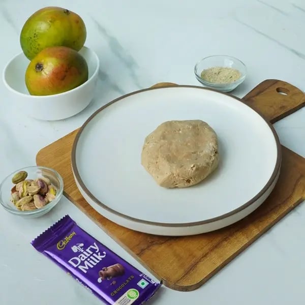 Dairy Milk Mango Sandesh Roll-Mix until it forms a hard consistency