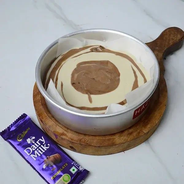 Dairy Milk Marble Coffee Cake - Add both batters into a cake pan