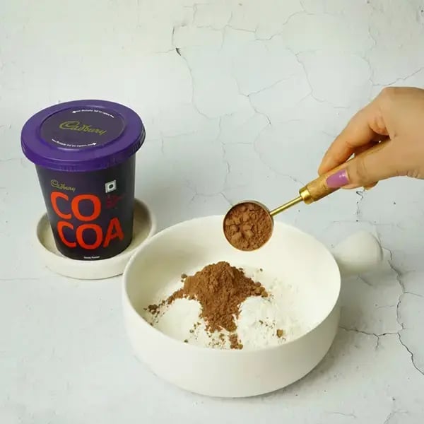 Dairy Milk Quick Fudge Nut Brownie - Add all-purpose flour and cocoa powder