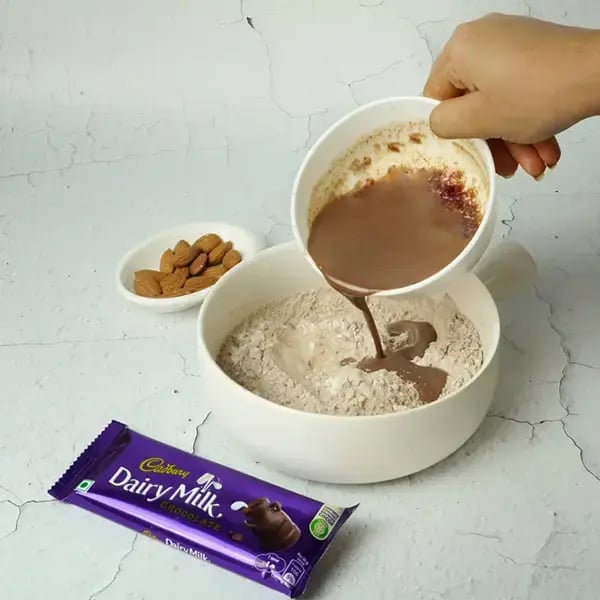 Dairy Milk Quick Fudge Nut Brownie - Pour the prepared chocolate mixture