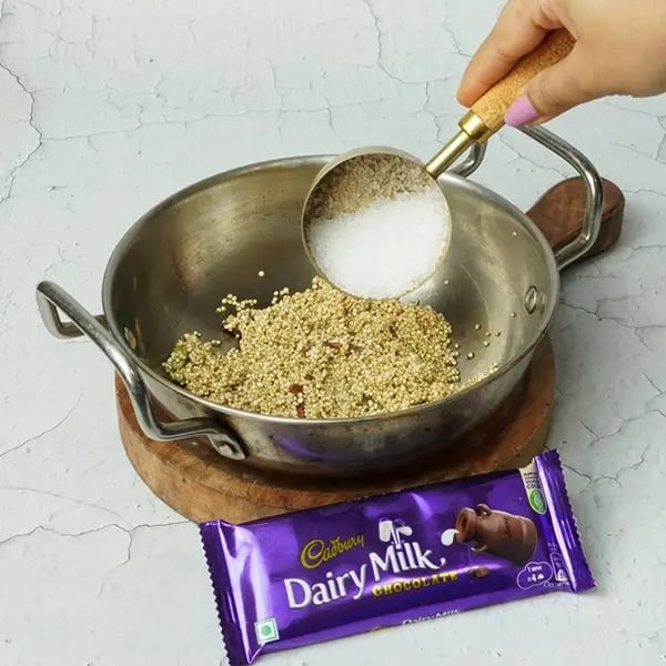 Dairy Milk Quinoa Lapsi-Now add sugar and cook again