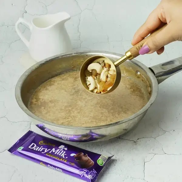 Dairy Milk Rice Kheer With Caramel Sauce - Add chopped nuts