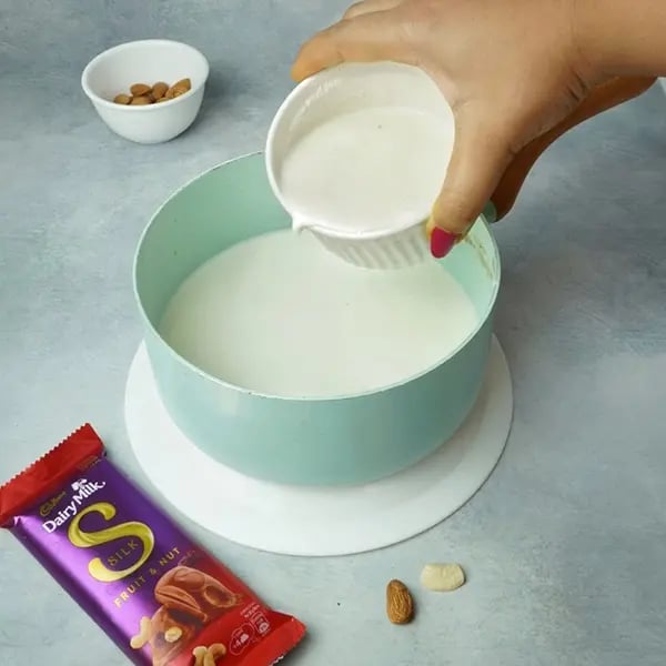 Dairy Milk Silk Chocolate Pudding with Cashew Almonds Garnish - Cornflour mix with milk