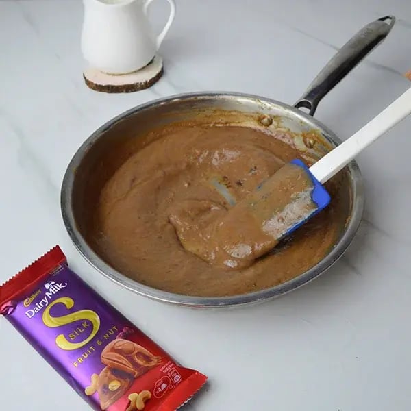Dairy Milk Silk Dates Payasam with Rose Cashew Crumble - Stir well and cook