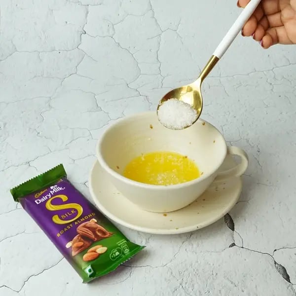 Dairy Milk Silk Gingerbread Mug Cake-Add melted butter and sugar to a cup