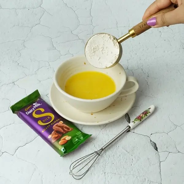 Dairy Milk Silk Gingerbread Mug Cake-Now add sieved all-purpose flour