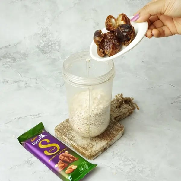 Dairy Milk Silk Oats Dates Bar - Add the pitted dates to the jar