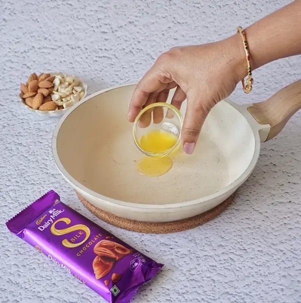 Dairy Milk Silk Peda with Almonds & Cashews-Heat 1 tbsp ghee in a non-stick pan on low heat.
