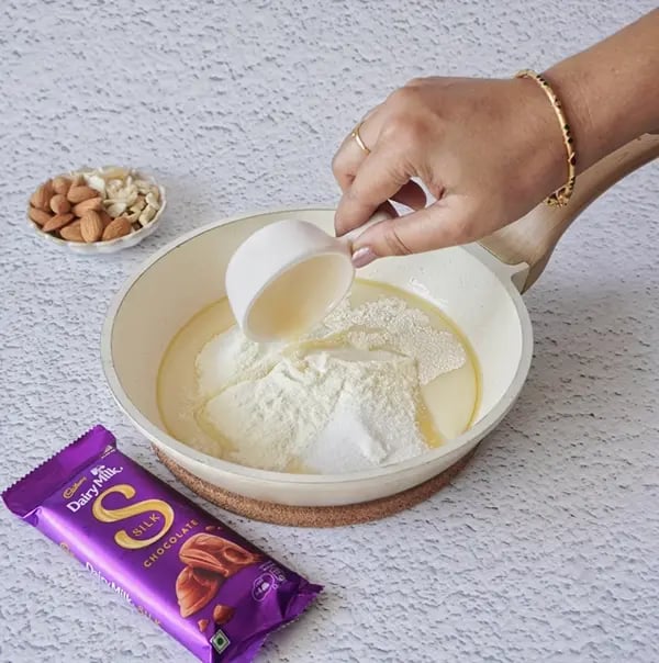 Dairy Milk Silk Peda with Almonds & Cashews-Add the condensed milk and milk powder