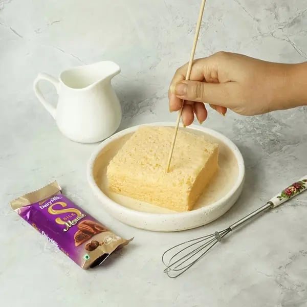 Dairy Milk Silk Tres Leches Cake-Cut the cake into a square shape